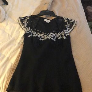 Sleeveless black dress shirt